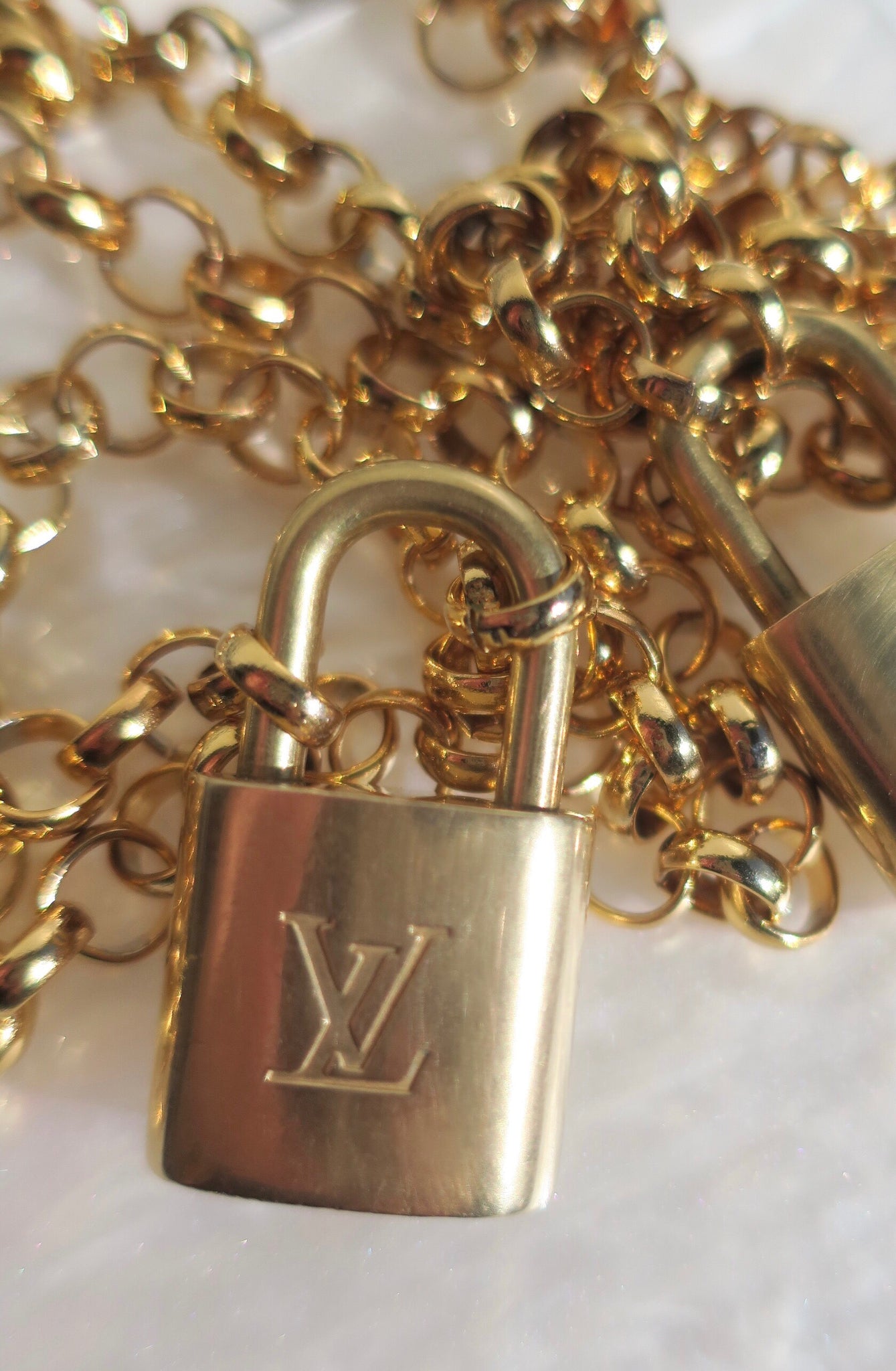 Repurposed vintage brass Louis Vuitton padlock 311 with layered style  necklace chains